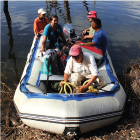 Project team members navigate the Macai River using a zodiac boat to get from one nesting area to another.